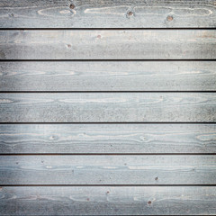 horizontal wooden planks with grey paint on fence