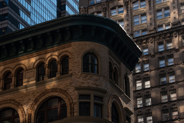 Close-up view of old and modern skyscrapers in Financial District Lower Manhattan New York City