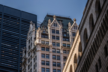 Fototapeta premium Close-up view of old and modern skyscrapers in Financial District Lower Manhattan New York City