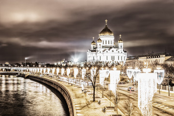 Night view of the Cathedral of Christ the Saviour and the embankment of Moscow river with it's night illumination. Moscow, Russia.