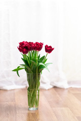 Artificial tulips in a vase
