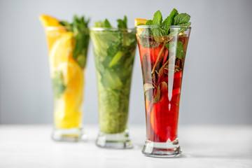 Refreshing cocktails with lime, lemon and pomegranate and mint. Concept for drinks, summer, heat, alcohol, party and bar