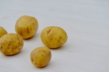 potatoes on wooden background