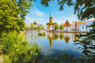 Historic city of Luebeck with Trave river in summer, Schleswig-Holstein, Germany - obrazy, fototapety, plakaty