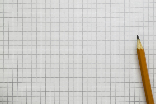 pencil on open notebook close-up, copy space.