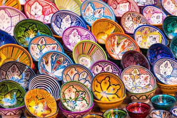 ESSAOUIRA, MOROCCO - NOVEMBER 20, 2018: Moroccan pottery in Essaouira. Colorful ceramics and pottery displayed outside a shop. Beautiful oriental design with plenty of colors.