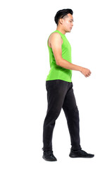 Fototapeta premium Full body length portrait of young fit man in sportswear, standing over white background