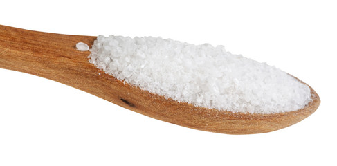 Fototapeta na wymiar side view of wooden spoon with Rock Salt close up