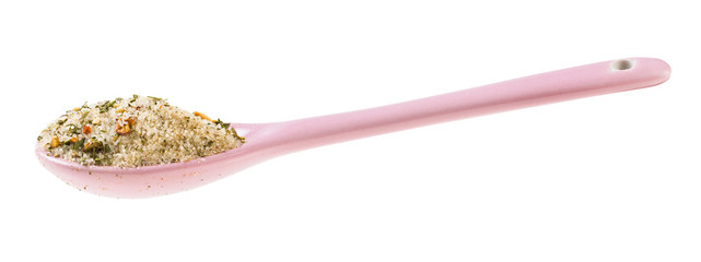 side view of ceramic spoon with seasoned salt