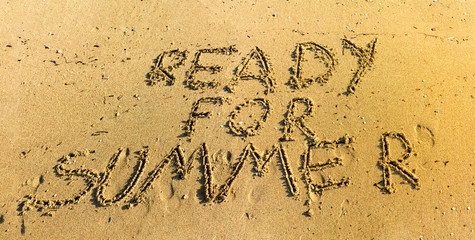 Ready for summer written in sand