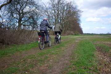 senior couple cycling in the countryside