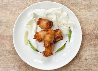 fried sour Thai sausage stuffed minced pork and glass noodles on plate