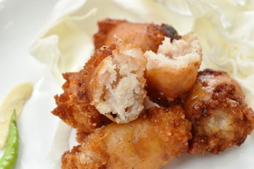 fried sour Thai sausage stuffed minced pork and glass noodles on plate
