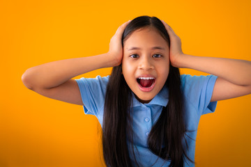 Close-up portrait of surprised pretty girl isolated orange background. - 257673745