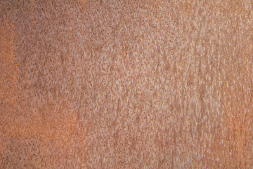 old brown rusty metal sheet with dots. rough surface texture