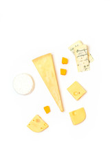 Assorted delicious fresh cheeses on a white background