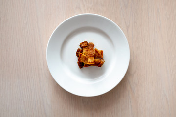 pieces of fat are lying on a white plate