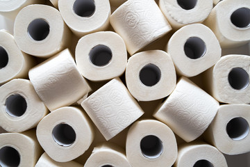 lots of toilet paper rolls. soft hygienic paper. close up - obrazy, fototapety, plakaty