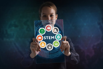 The concept of business, technology, the Internet and the network. A young entrepreneur working on a virtual screen of the future and sees the inscription: STEM