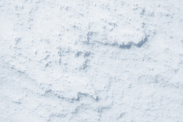 Fresh snow background texture. Winter background with snowflakes and snow mounds. Snow lumps.