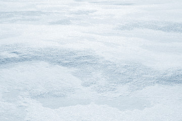 Obraz premium Fresh snow background texture. Winter background with snowflakes and snow mounds. Snow lumps.