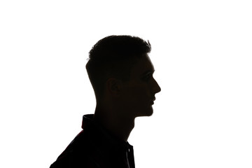 Silhouette of man looking away isolated on white