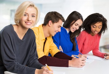 Fototapeta premium Group of Students with computers at lesson in classroom