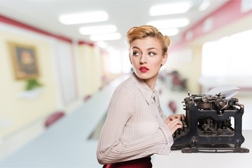 Old typewriter with books  on background