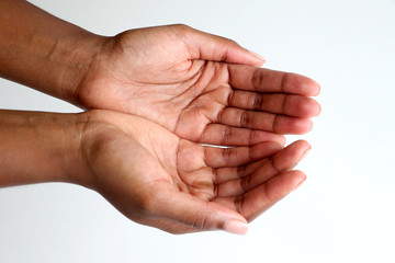 Black African hands out reaching, begging, showing with palms up