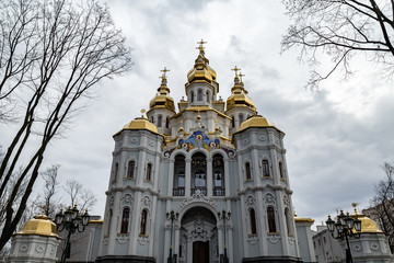 Fototapeta na wymiar Kharkiv, Ukraine: Mironositskaya Church, known also as Myrrh-Bearers temple, is located in Peremohy Garden Square in front of the State Academic Opera and Ballet Theatre