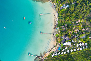 Aerial view. Beautiful tropical beach and wooden bridge in the sea in island Koh Kood Thailand