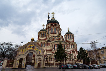 Fototapeta na wymiar Kharkiv, Ukraine: The Annunciation Cathedral is the most important Orthodox church of Kharkiv. The candy striped cathedral features a pentacupolar Neo-Byzantine structure with an 80 m bell tower