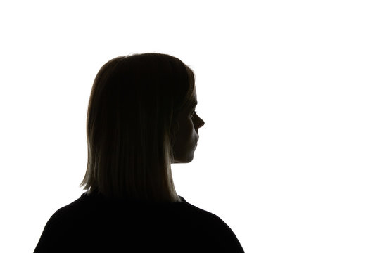 Silhouette of woman looking away isolated on white