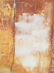 Textured abstract background old brick wall dirty vintage red sunny day