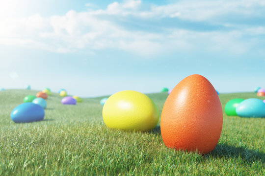 Colorful eggs in a meadow on a sunny day against the blue sky. Multicolored painted easter eggs on grass, lawn. Concept easter eggs hunt in sunday. Easter symbol holiday in April. 3D illustration