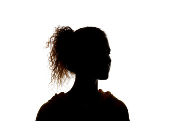 Silhouette of curly girl with ponytail isolated on white