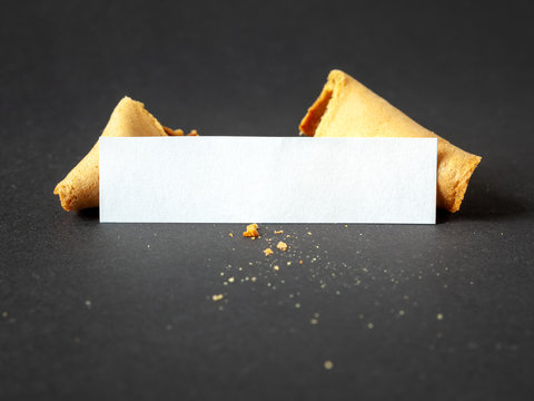a fortune cookie with a blank paper for your message