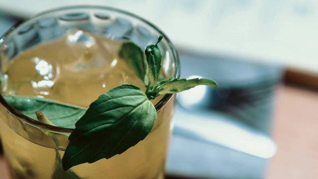 Awesome fresh summer long drink with mint leaves & lime slice served with white rum,vodka & ice in high bocal glass.Enjoy refreshing longdrinks at the bar.Restaurant or cafe alcohol menu