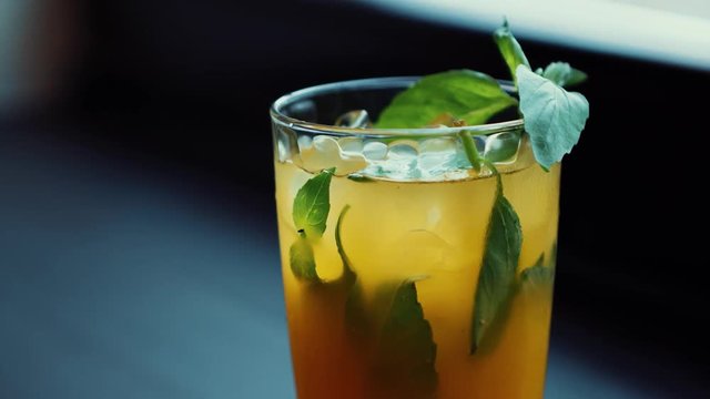 Awesome fresh summer long drink with mint leaves & lime slice served with white rum,vodka & ice in high bocal glass.Enjoy refreshing longdrinks at the bar.Restaurant or cafe alcohol menu