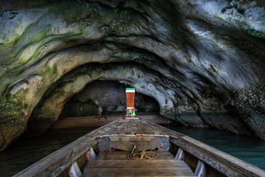 long tail boat into Kaew Cave on Panak Island at the Andaman Sea near James Bond Island on Phang Nga bay, Thailand : Famous landmark and famous travel destination on Phang Nga bay, Thailand
