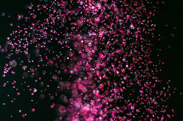 abstract bright colorful violet and red bokeh glitter sparkle blurred background. like molecule spread and absorb.