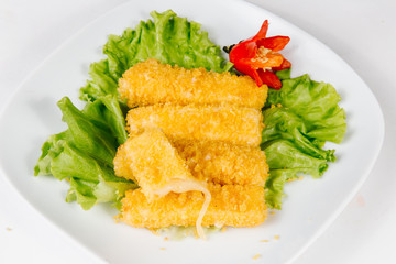 Traditional oriental cuisine of  Vietnam. Tempura cheese nem  in breading on a white background