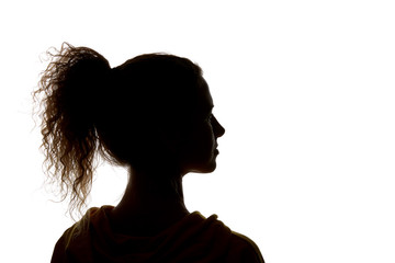 Silhouette of curly girl with ponytail isolated on white