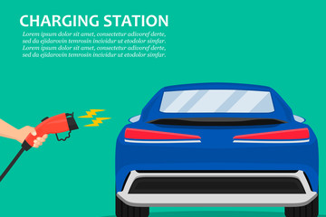 Hand holding charging plug for electric car charging station