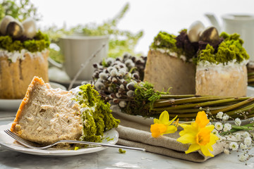Caramel cottage cheese dessert (Paskha), Easter cakes with icing sugar and colorful painted eggs on table. Traditional Easter treats of Russia and Ukraine for Orthodox Easter. Easter symbols
