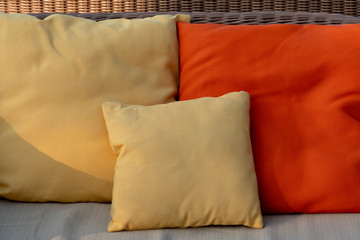 The exterior decoration of the sofa with yellow and orange leaf pillows.