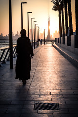 Woman walking towards Burj Khalifa