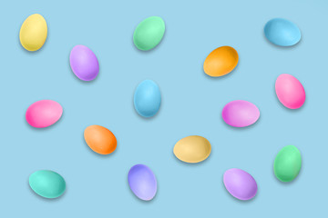Pastel colored Easter eggs on blue background, Easter pattern