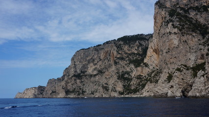Fototapeta na wymiar Cliff scenery and rock formations on the island of Capri in the Bay of Naples, Italy. Photographed whilst on a boat trip around the island.