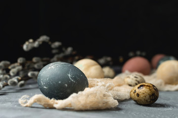 Spring easter minimal background rustic style composition - organic naturally dyed easter eggs, willow banch